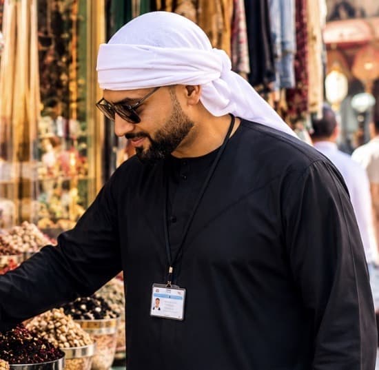 Muhammad Bilal, licensed Dubai tour guide, at a spice stall in the Dubai Spice Souk